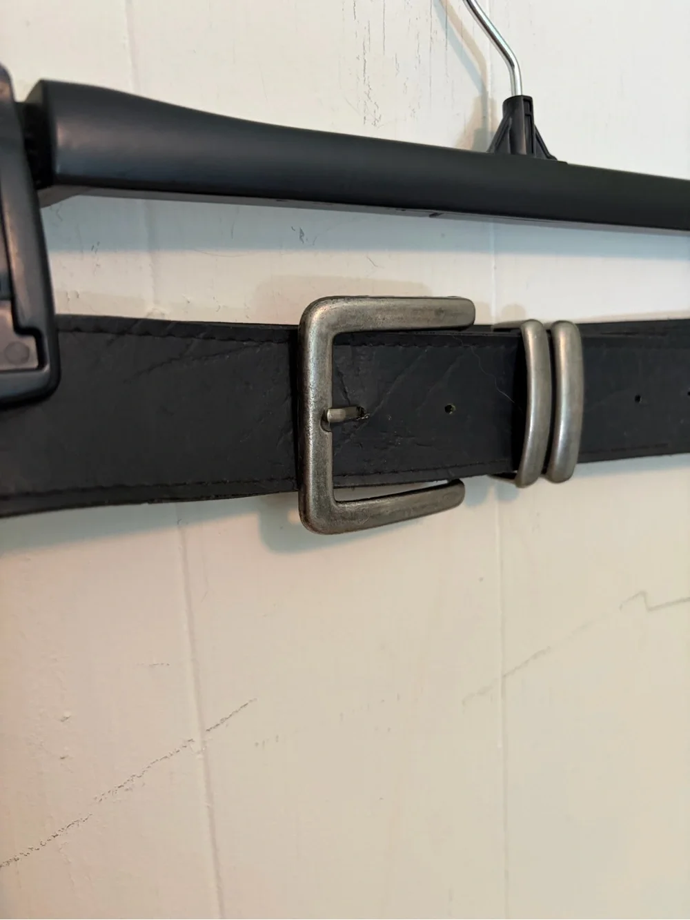 Unisex black belt with modern, brutalist silver buckle and details